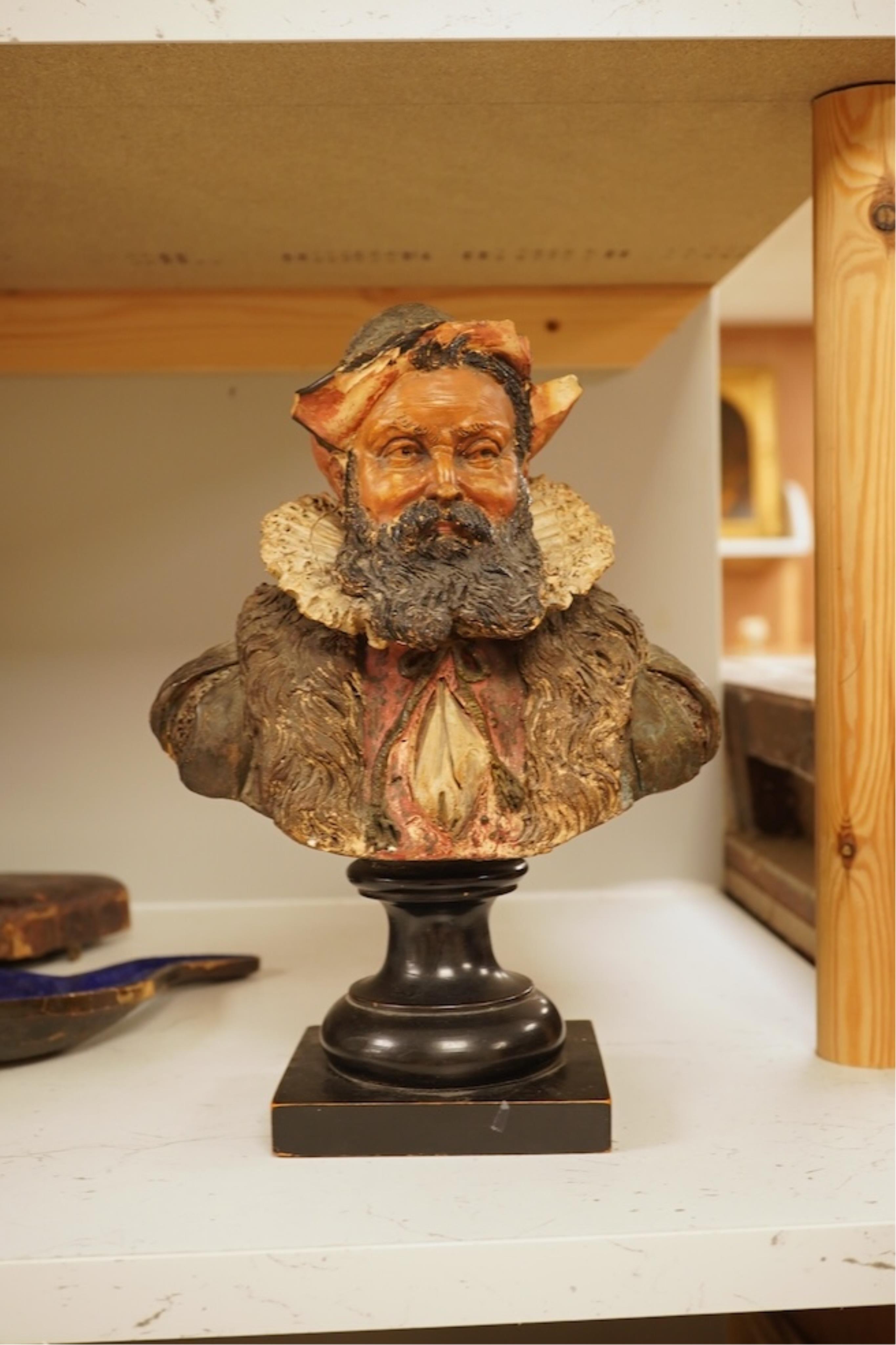 A 19th century German cold-painted terracotta bust, on ebonised socle and a Meerschaum pipe in case, bust 27cm high